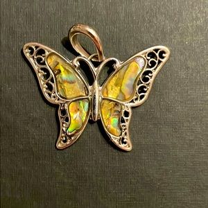 Silver Butterfly Pendant, Shells as part of the work he and scroll work. New